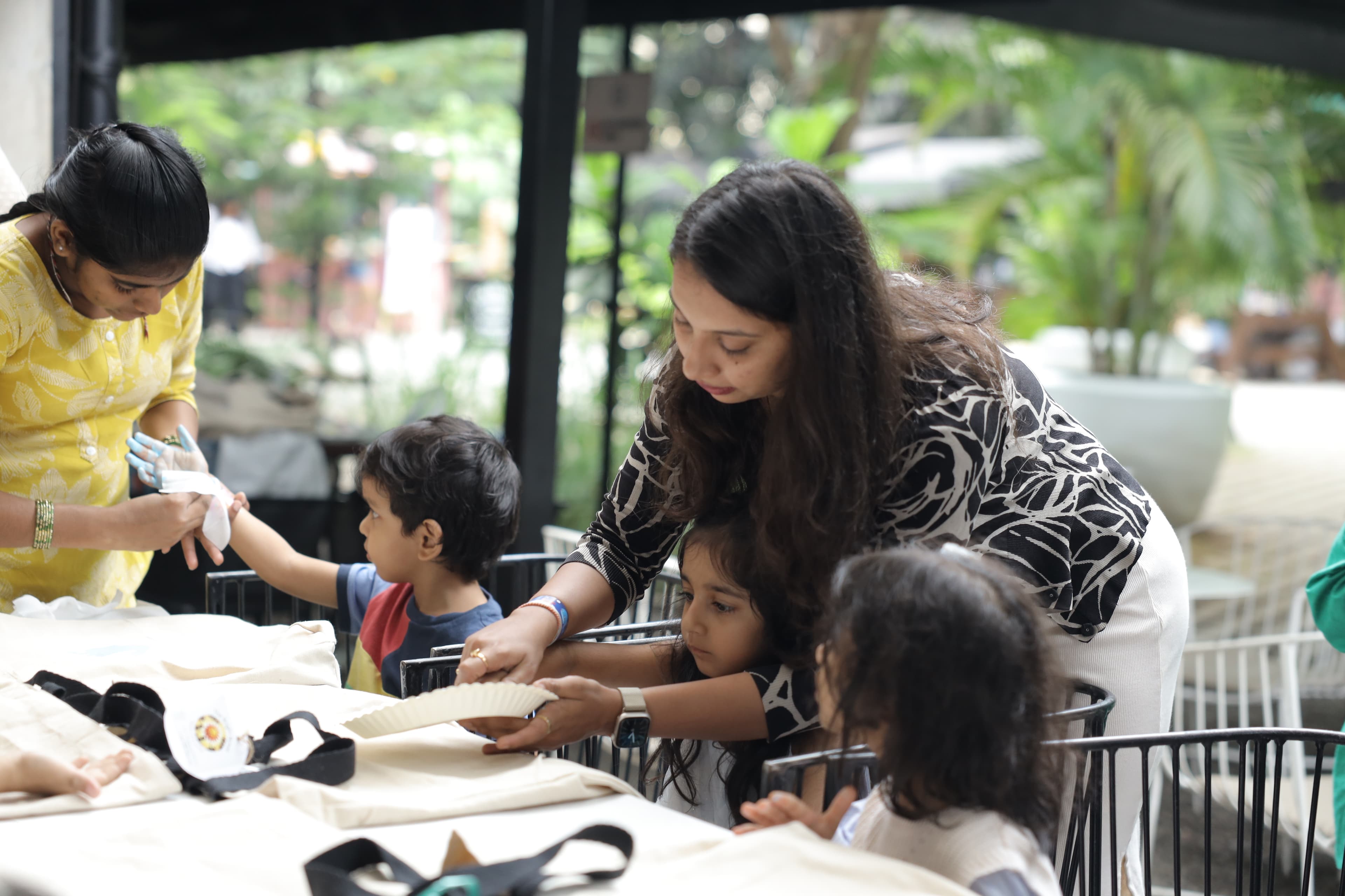 Teacher and young students sharing a joyful moment of discovery in the classroom